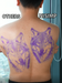 Tattoo artist using NISIMP wireless stencil printer in studio